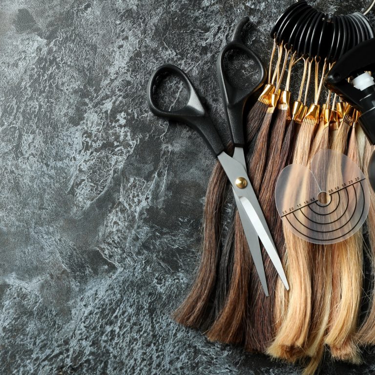 Composition with hair extension accessories on dark background